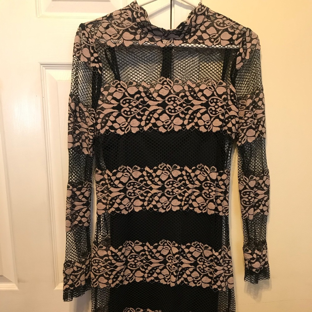black and tan lace mini dress with floral design